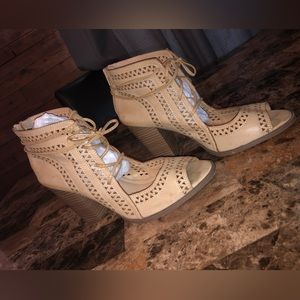 Restricted size 9 leather wedge heel lace-up bootie